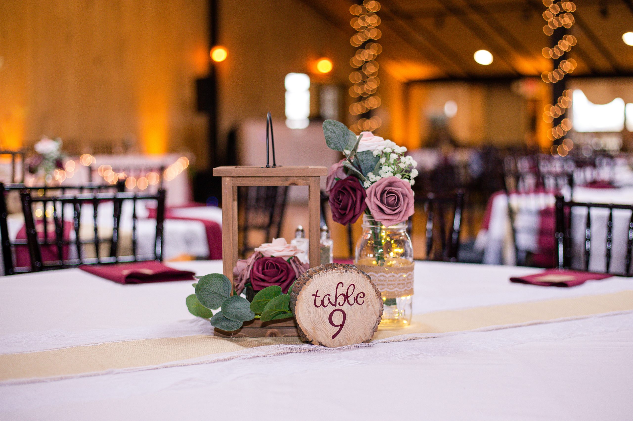 Reception tables set for a wedding in the Thunderbird Room at The Lodge at Indian Lake